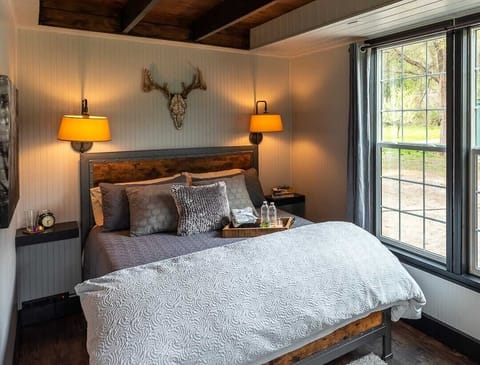 The "Timber Room" features luxury bedding and convenient reading lights.