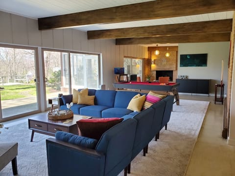 Large Living room with large sectional in front of fireplace 