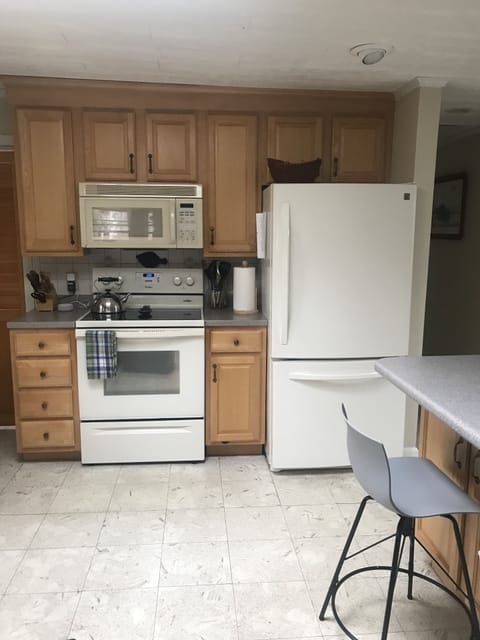 Full size refrigerator and over with microwave allows you to feel at home.