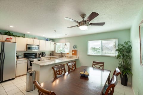 Dining table seats 6, plus 2 extra barstools. (Also a 1/2 bath on this level)
