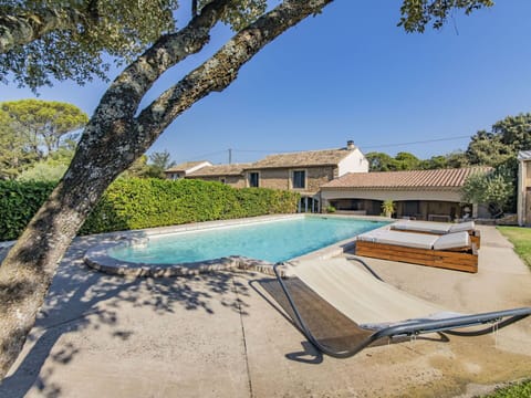 Water, Plant, Sky, Building, Swimming Pool, Azure, Shade, Outdoor Furniture, Tree, Sunlounger