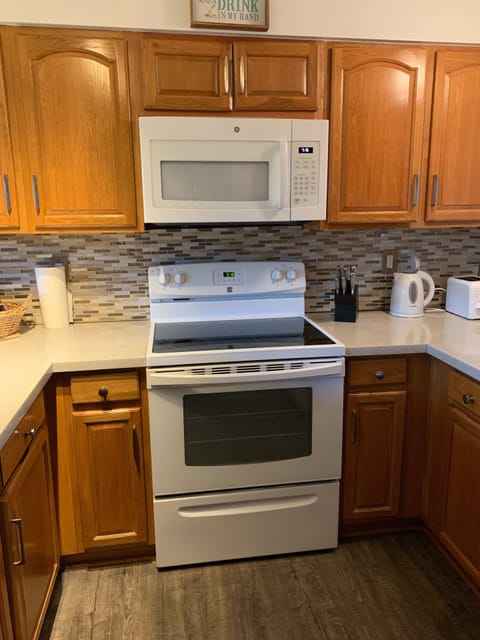 Fully stocked kitchen with standard size refrigerator.