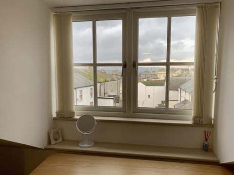 Third floor bedroom looking out to hills