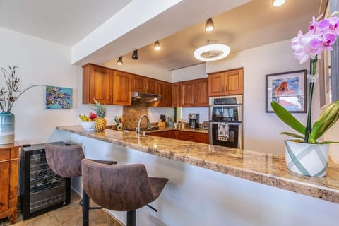 Wine fridge to keep your bottles chilled; Seating for the backseat sous chefs!