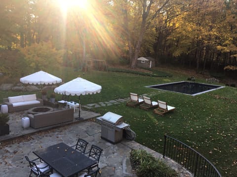 Beautiful entertaining patio and backyard with pool to enjoy the fall foliage!