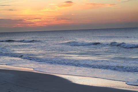 Sunrise over the Ocean on Hilton Head Resort private beach at end of boardwalk