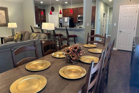 Spacious dining table set for shared meals, memories, and holiday gatherings.