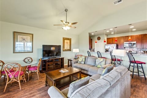 Light-filled living room with comfortable seating for movie nights or laid-back evenings.