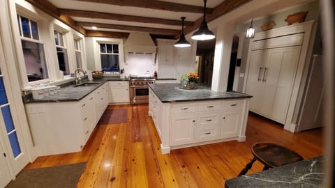 Stove, soapstone island and sub zero fridge. Ice maker and wine/bev fridges.