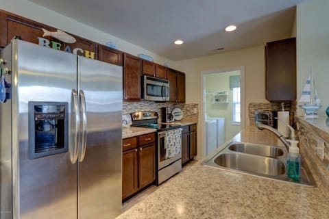 Fully equipped kitchen with laundry room attached 