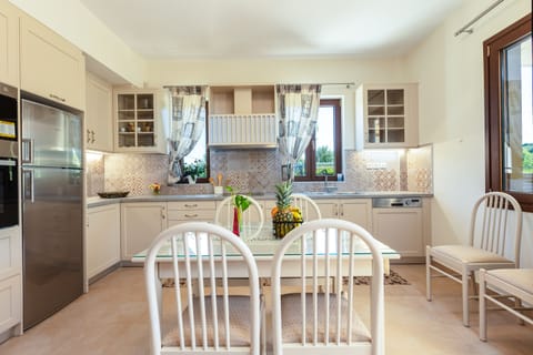 The kitchen table can seat up to 6 guests and outdoor dining table for 8 guests