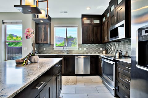 Entrada at Moab 417- Kitchen Area with Appliances & Island in the middle