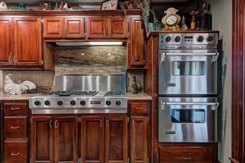 Double ovens and 6 burner cook top, microwave.