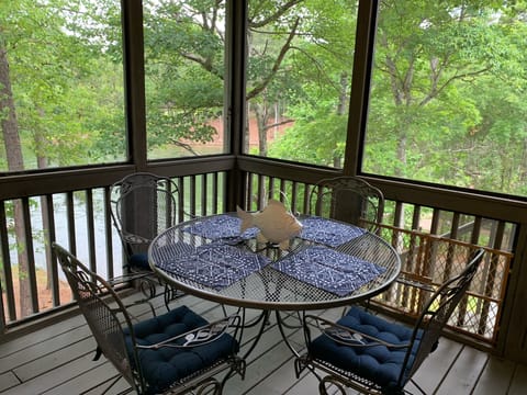 Table on screened in porch - great for dining or playing games in the evenings!