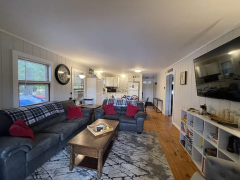 Cozy living room with large flat screen tv. Books and games for all ages!!