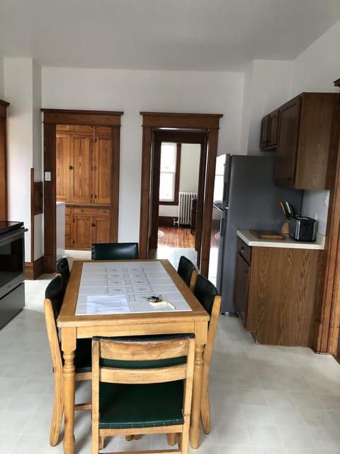 Kitchen area looking down hallway to bathroom and bedroom. 