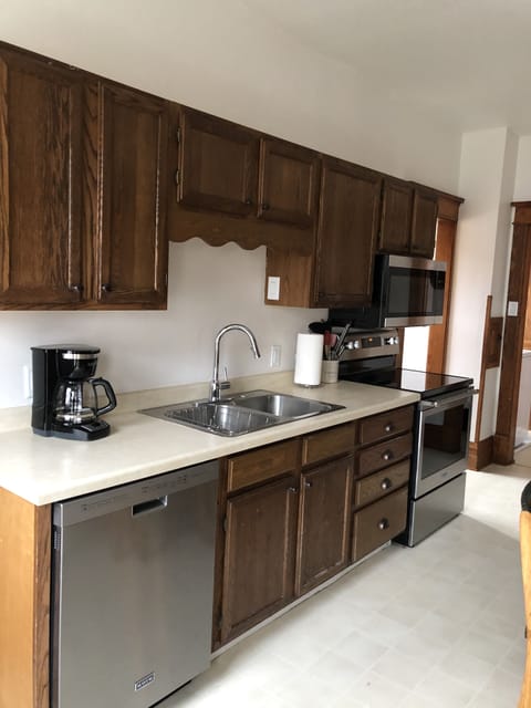 Kitchen. Dishwasher, smooth top stove, ice maker in frig, above stove microwave 