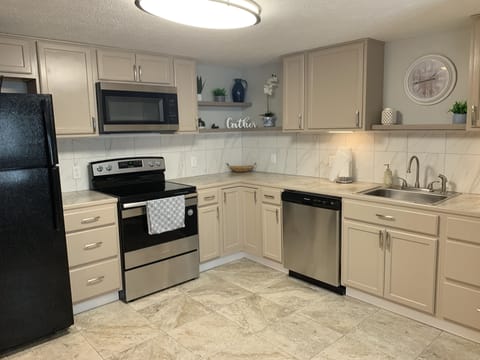 Fully stocked kitchen, Plates, cups, coffee pot, pots and pans utensils 