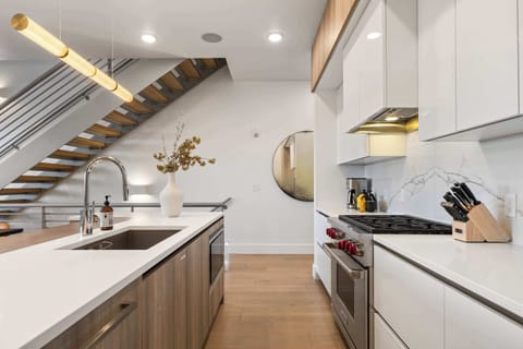 Fully stocked open kitchen with Wolf and Sub-Zero appliances