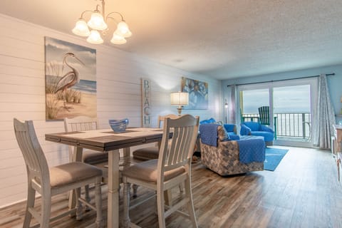 Remolded Great Room  Shiplap Walls New dning and Living Room Furniture New Sliding Glass Door Direct Oceanfront View