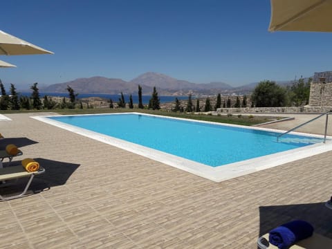 Pool. The 82sqm swimming pool with free umbrellas and sunbeds