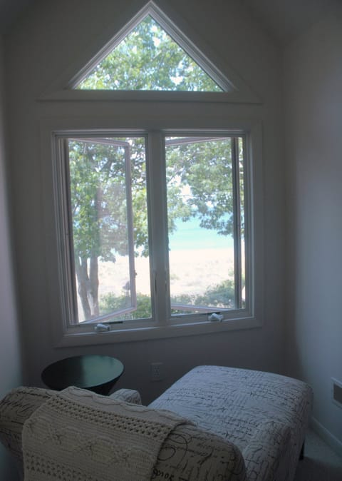view of lake from 2nd floor king bedroom/chaise lounge