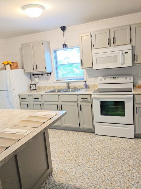 Kitchen, featuring stove, fridge, and basic essentials, dishes etc.