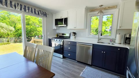 Eat-in kitchen with slider to side yard