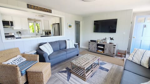 Living room with comfortable seating and flat screen TV