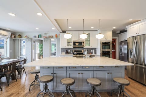 The large island has quartz countertops and seating for six.