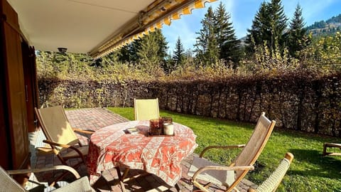 Imagine a stunning patio adorned with lush green grass and a cozy sitting area, ideal for enjoying a delightful breakfast in the fresh morning air.