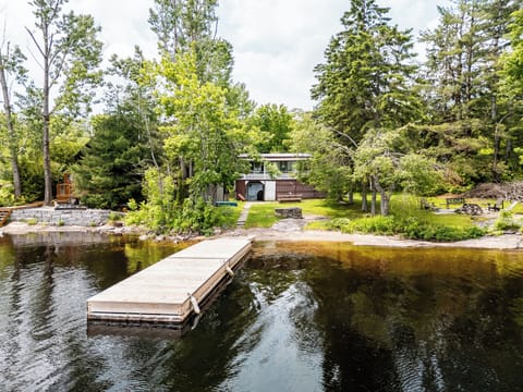 Featuring a 100ft private sandy beach with 32 foot dock.