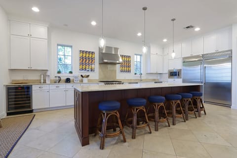Kitchen with stainless steel appliances and breakfast bar