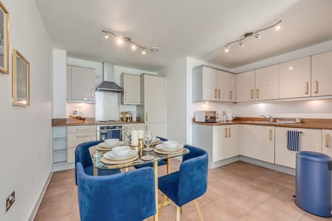 The apartment features a well-equipped kitchen complete with a dishwasher, fridge freezer, oven, stove, microwave, kettle, toaster, cookware, tableware, and utensils are all provided.