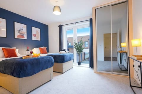 Bedroom with a comfortable zip link bed which is configured as two single beds by default or can be zipped together to form a king size bed upon request.
