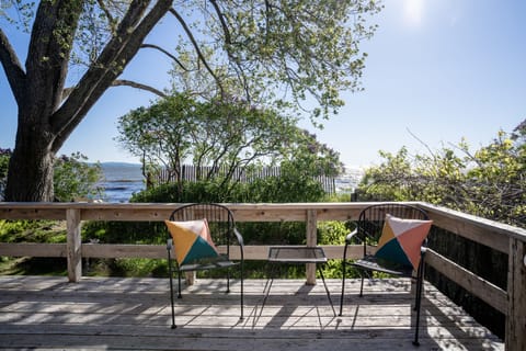 Listen to the waves & soak in the drops of morning sun from the deck.