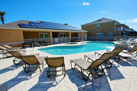 Lounge at the community pool near the townhome.