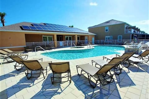 Lounge at the community pool nearby the townhome.