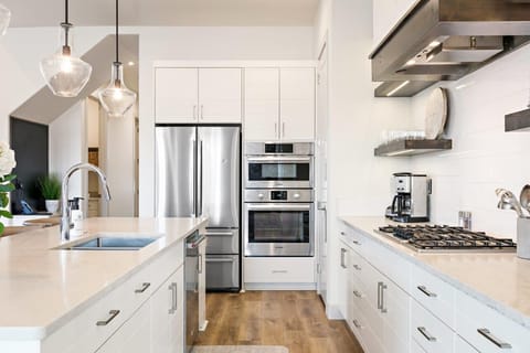 Kitchen is stocked with appliance and utensils