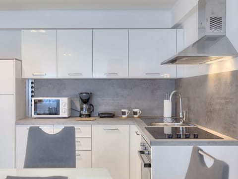 White, Room, Property, Countertop, Kitchen, Furniture, Cabinetry, Interior Design, Tile, Kitchen Stove