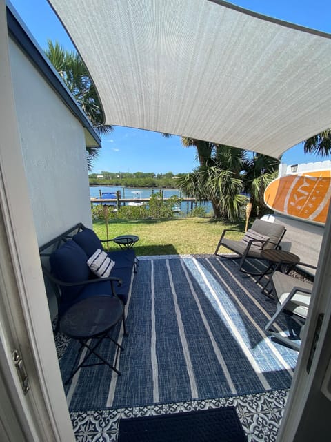 View from Kitchen sliders onto patio and river
