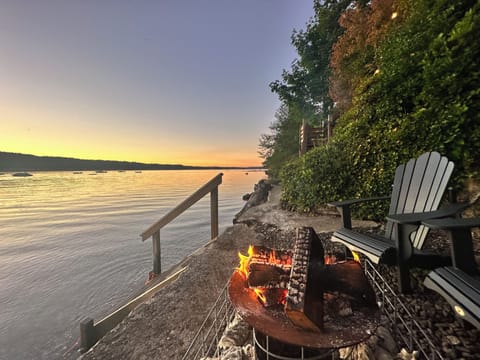Watch sunsets on the bulkhead right next to the beach while enjoying a fire