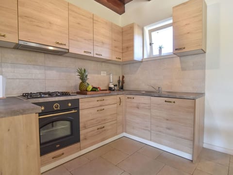 Countertop, Cabinetry, Property, Room, Furniture, Kitchen, Tile, Kitchen Stove, Floor, Building