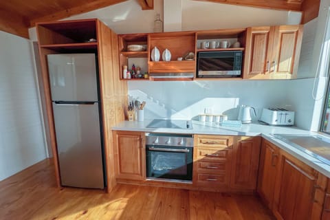 Kitchen has electric hot plates and oven, microwave etc.