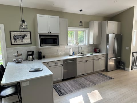 Gourmet kitchen with large counter with seating for 4.