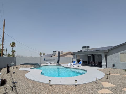 outdoor pool, spa tub, patio, umbrella, loungers, outdoor dining set, grill