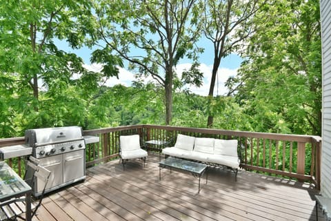 Private patio with Natural Gas Grill, seating and table.