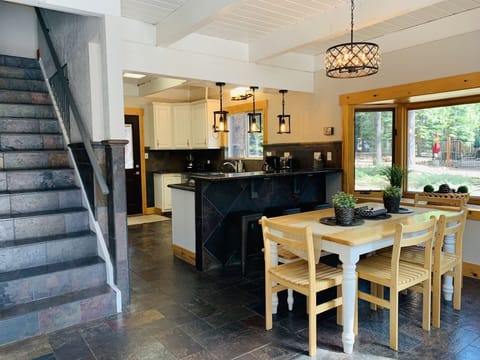 Kitchen/Dining Room and stairs leading to second floor. 
