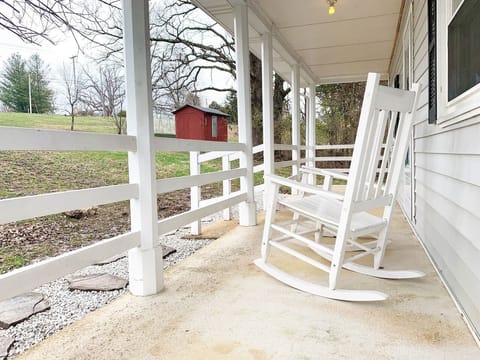 Rockers on the front porch look out over the large front yard