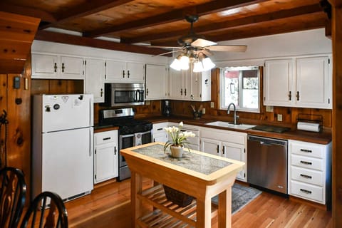 Full kitchen stocked with dishes, pots and pans, coffee maker, toaster, and more!